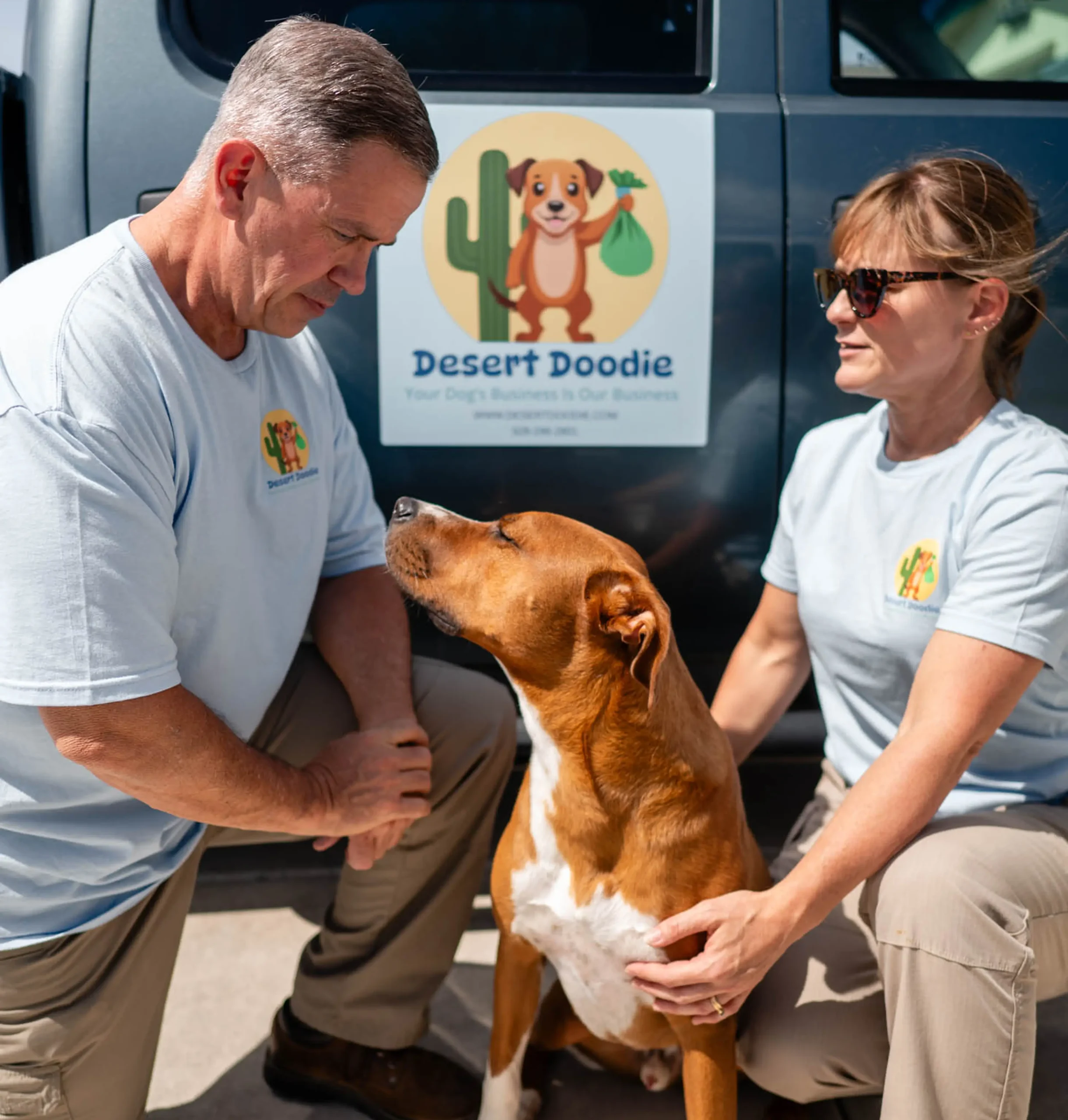 image 2 (2) Two people interacting with a brown dog in front of a vehicle.